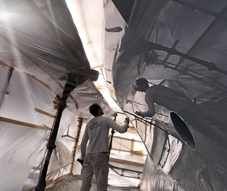 Superyacht painting specialists working on a luxury yacht
